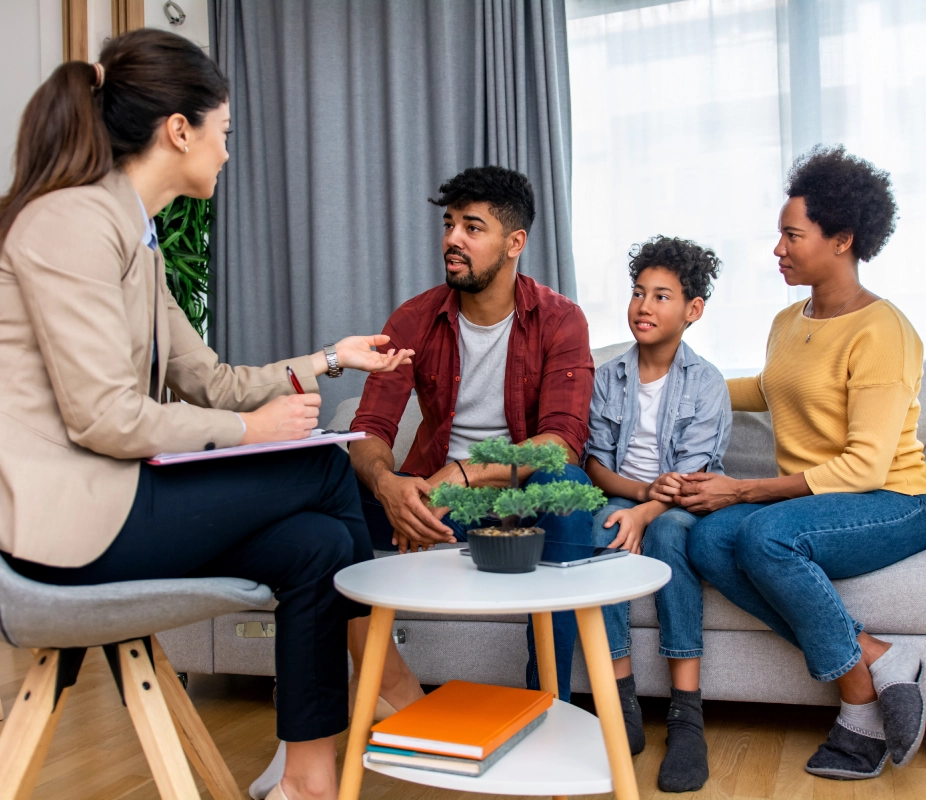 Family having a discussion with a counselor.